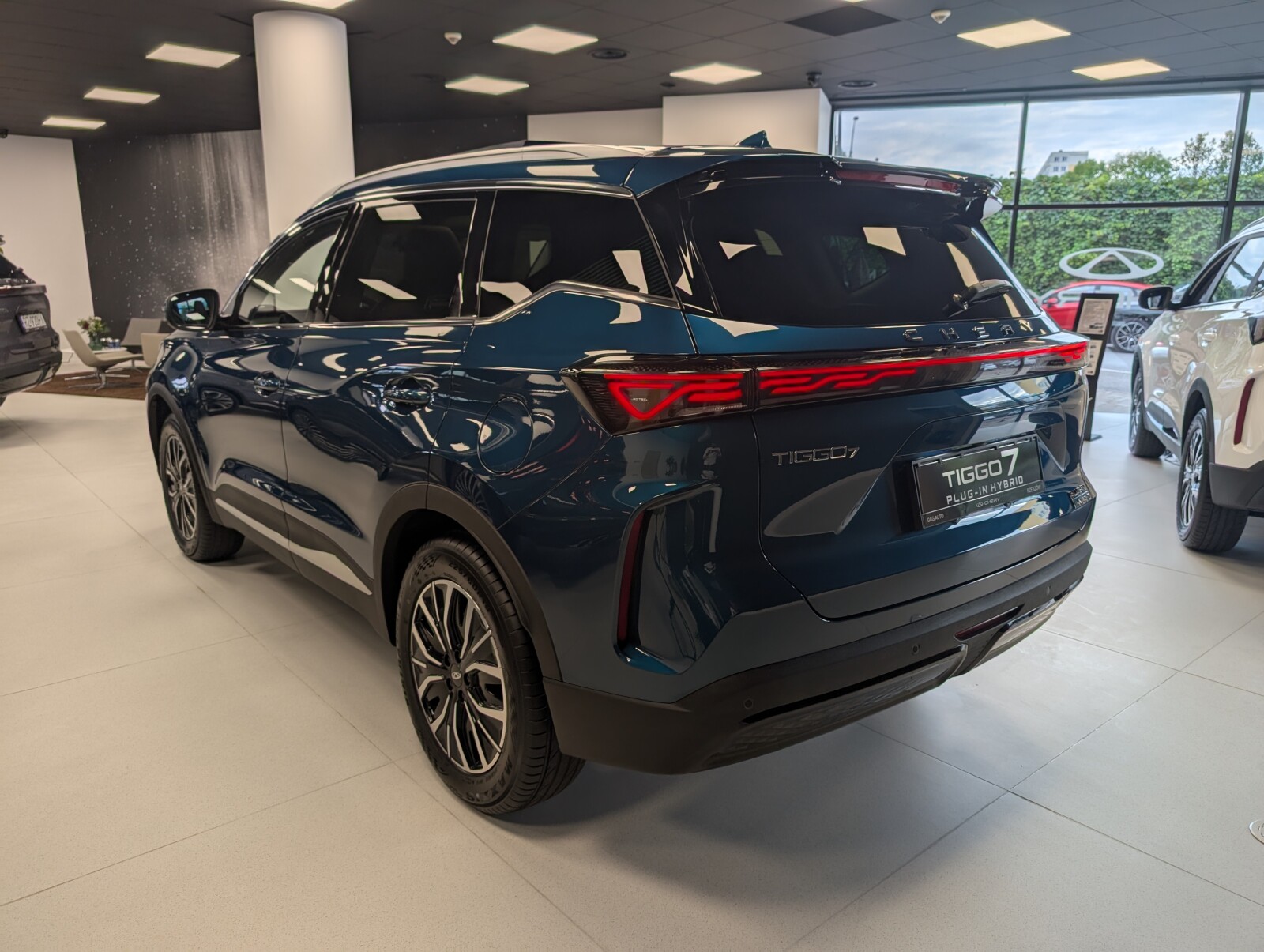 Chery Tiggo 1,5 PHEV 205 kW Automatik Baujahr 2025, niebieski, Polen — Foto 8 von 9
